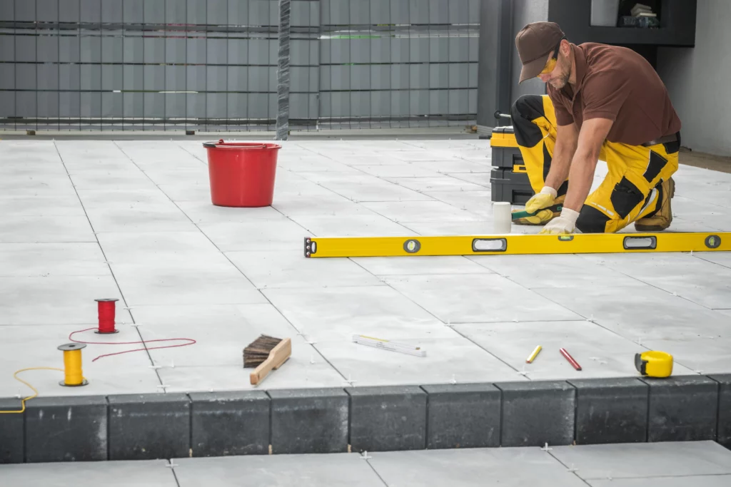 Outdoor patio tiles installation service by professionals, featuring exterior house painting service and exterior cleaning service.